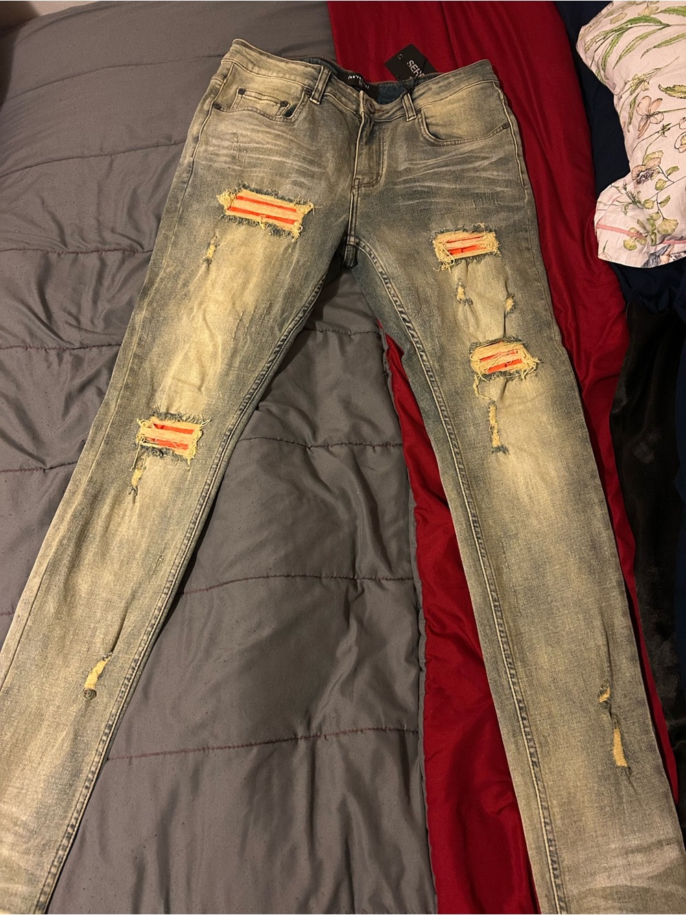 Men's Skinny Distressed Light Wash Jeans with Orange Patch Inserts